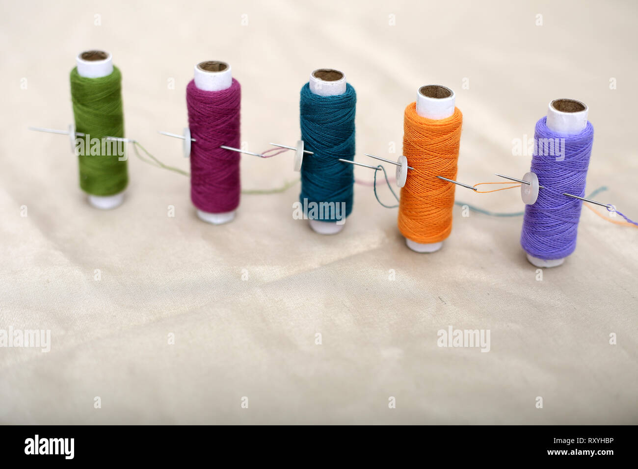 Picture of Multicolored sewing thread and needle on the cloth Stock ...
