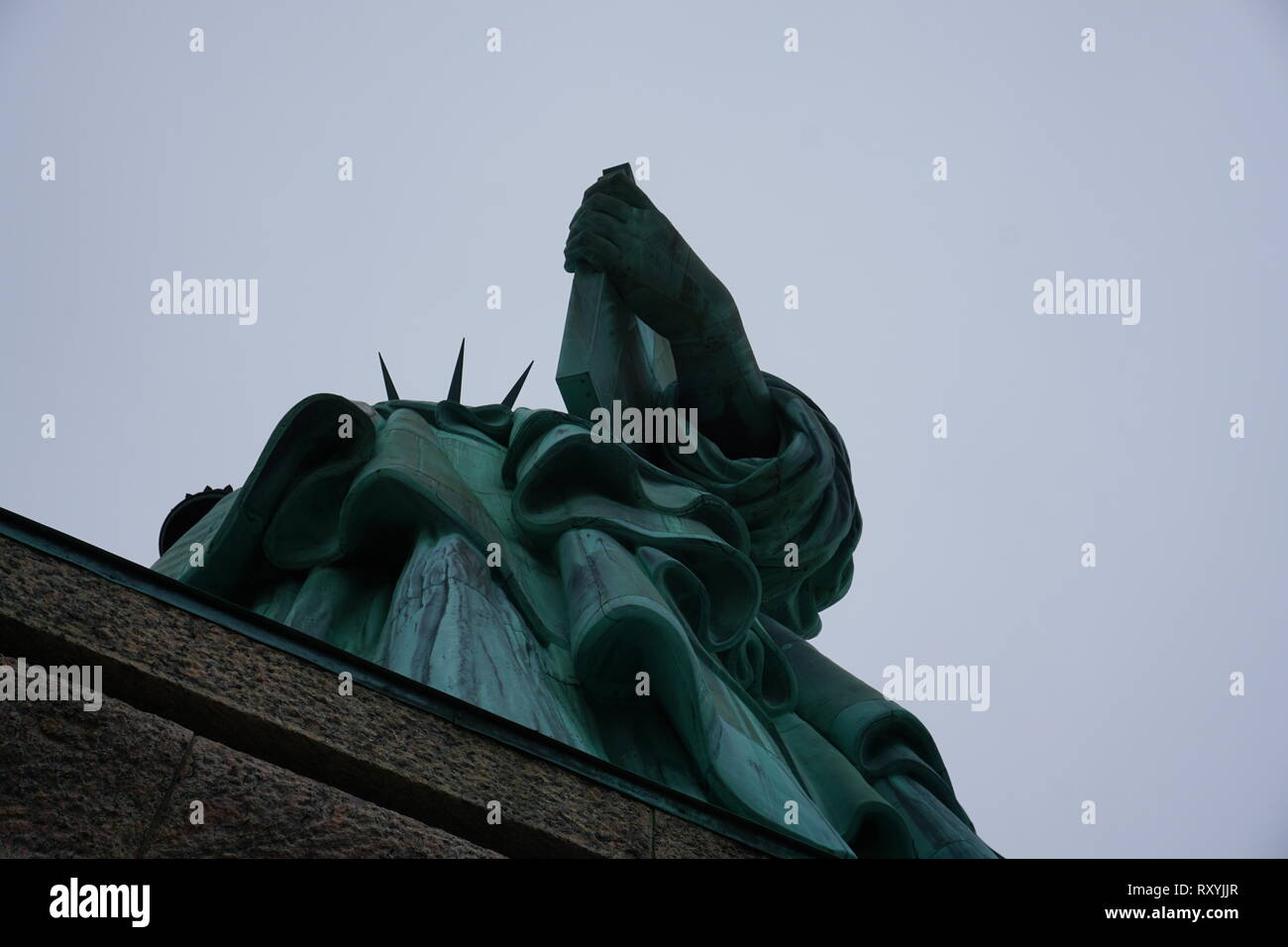 November 2018 - Statue of Liberty on light blue sky, landmark in New York City, USA, bottom view. Stock Photo