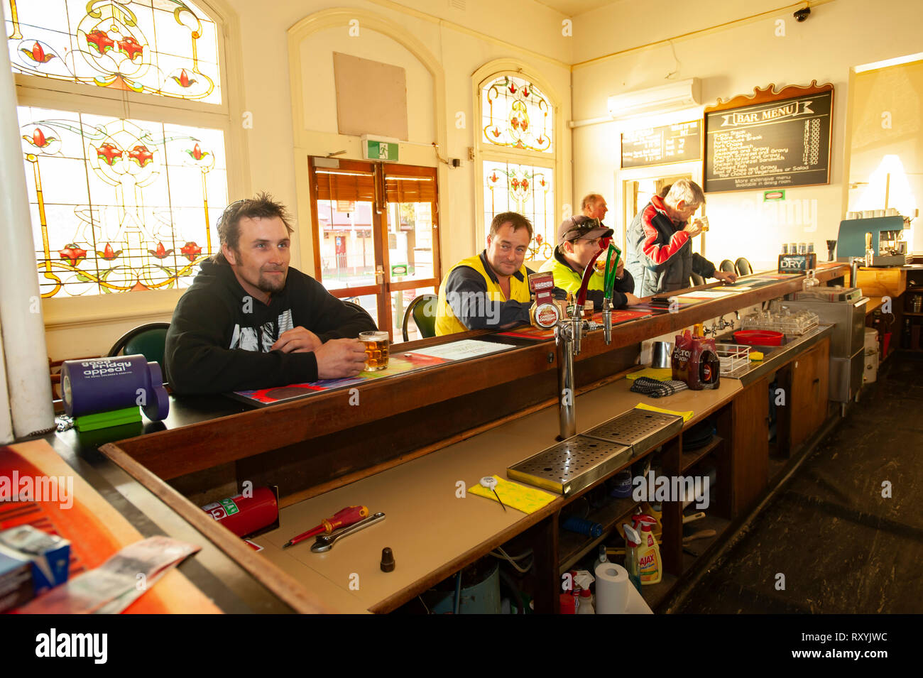 Workers at the bar of a pub having a drink after work Stock Photo Alamy