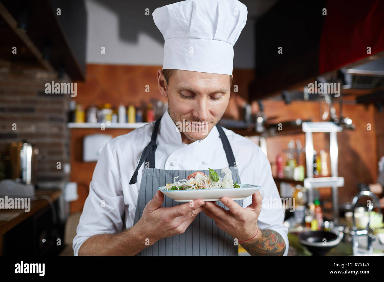 Proud Chef Presenting Dish Stock Photo Alamy