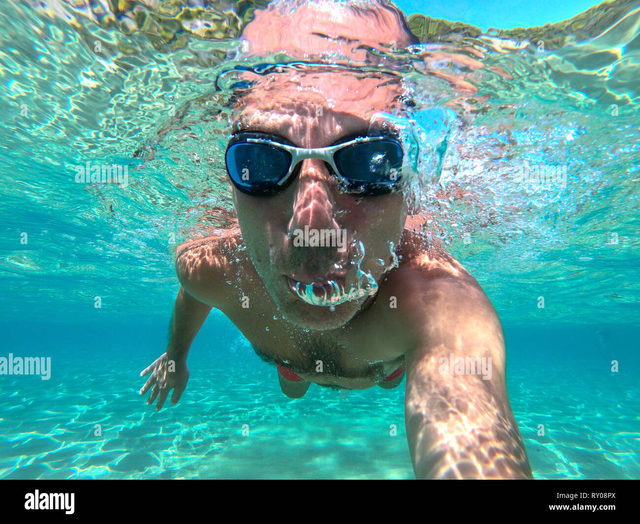 Young man coming out of water hires stock photography and images Alamy