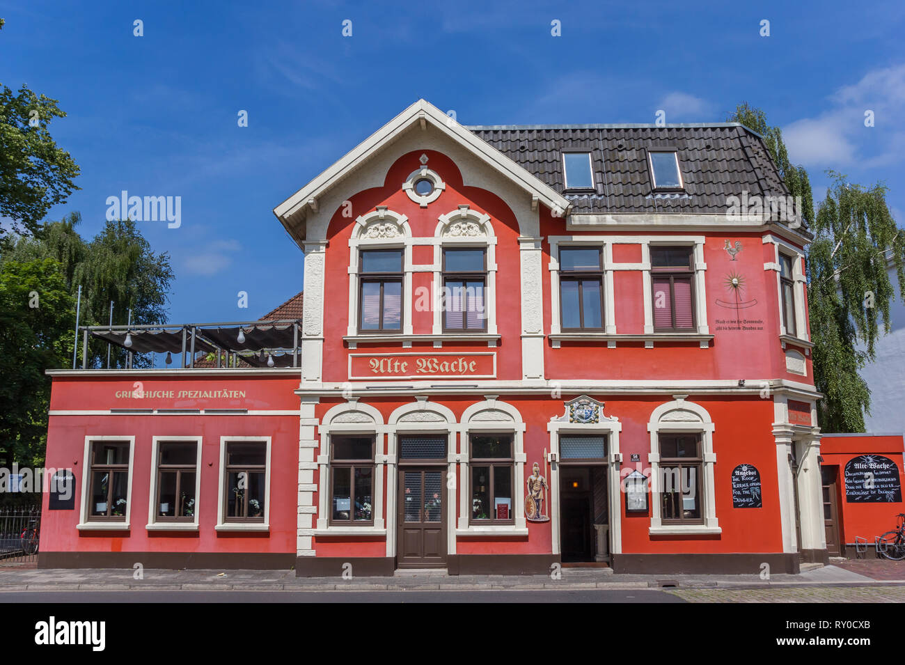 Colorful red restaurant in the center of Aurich, Germany Stock Photo