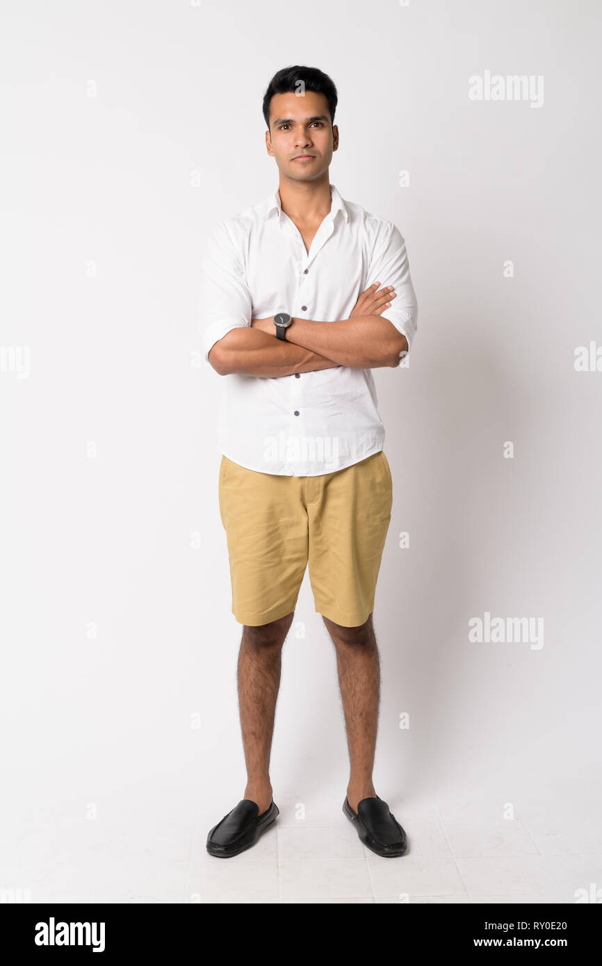 Full body shot of young handsome Indian man with arms crossed Stock ...