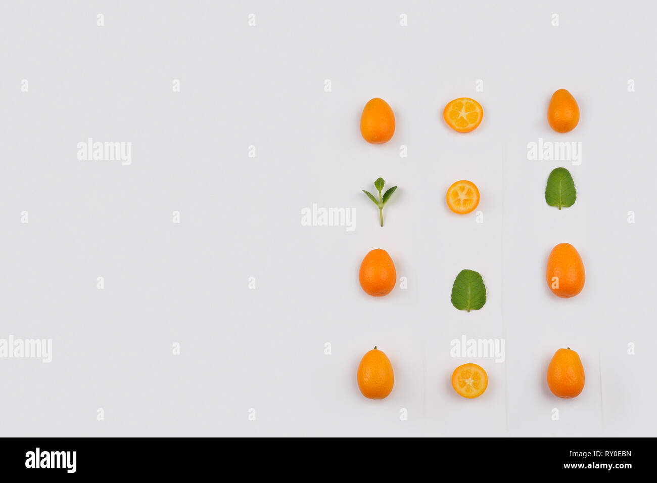 Fresh  organic kumquats pattern . Fruit with  sweet tart citrus refreshing flavour. Kumquat means “golden orange'.A bit larger than an olive, it  look Stock Photo