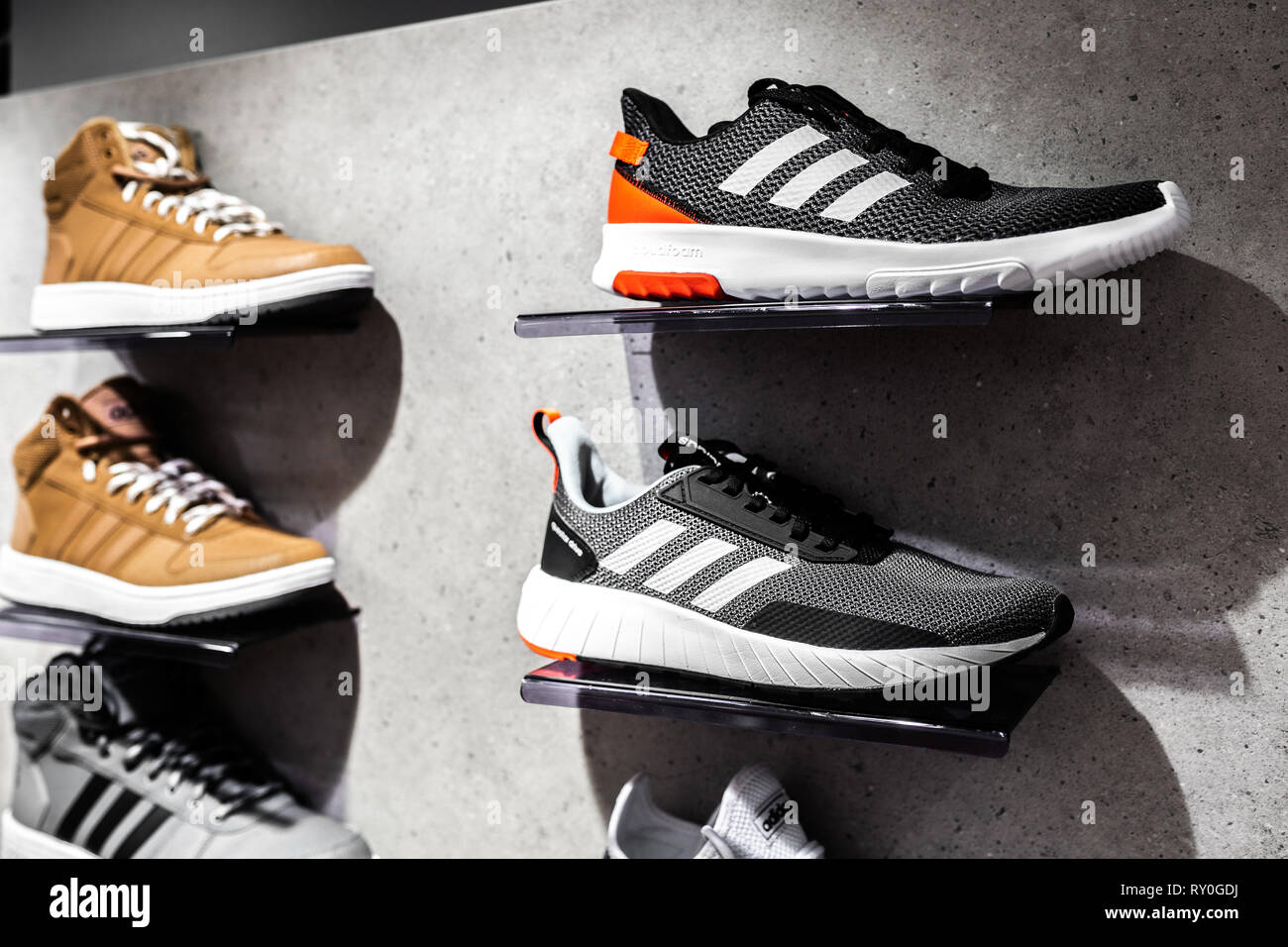 Nurmberg, GERMANY - February 27, 2019: The ADIDAS black man sneakers on the  shell in the shop. Fashionable foot wear shoes. Close up photo sport conce  Stock Photo - Alamy