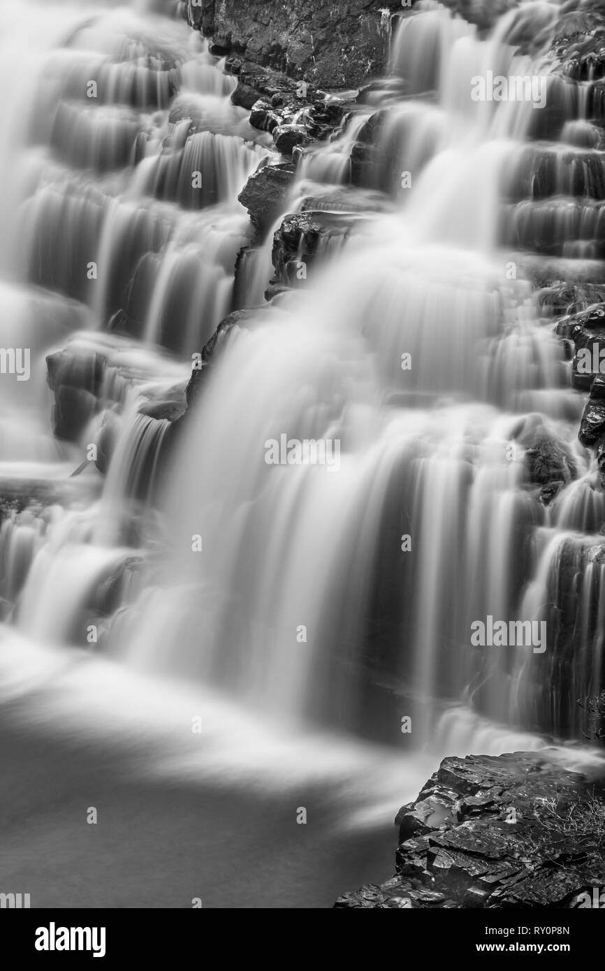 Corra Linn Falls at the Falls of Clyde New Lanark. An image of New Lanark with the lower falls in spate. Use of  a 10 times Neutral Density Filter. Stock Photo