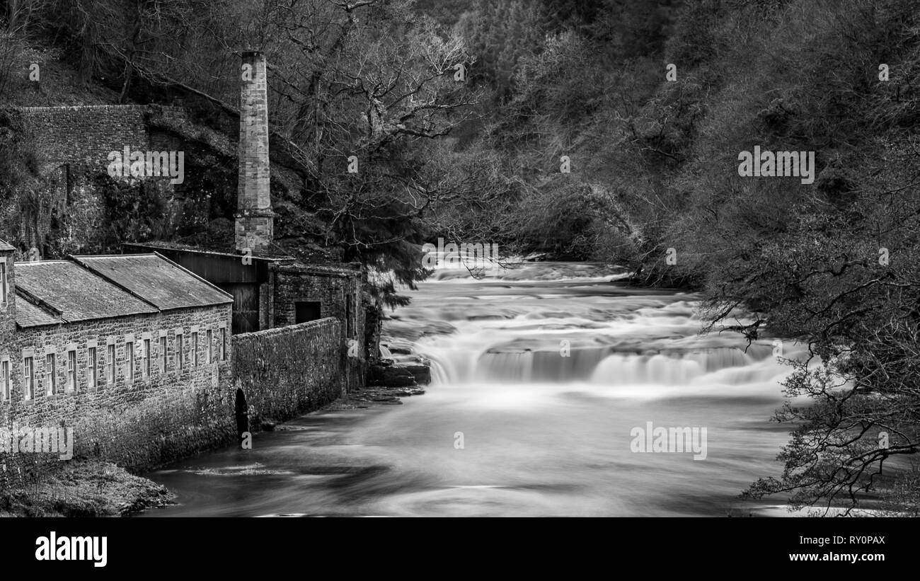 Corra Linn Falls at the Falls of Clyde New Lanark. An image of New Lanark with the lower falls in spate. Use of  a 10 times Neutral Density Filter. Stock Photo