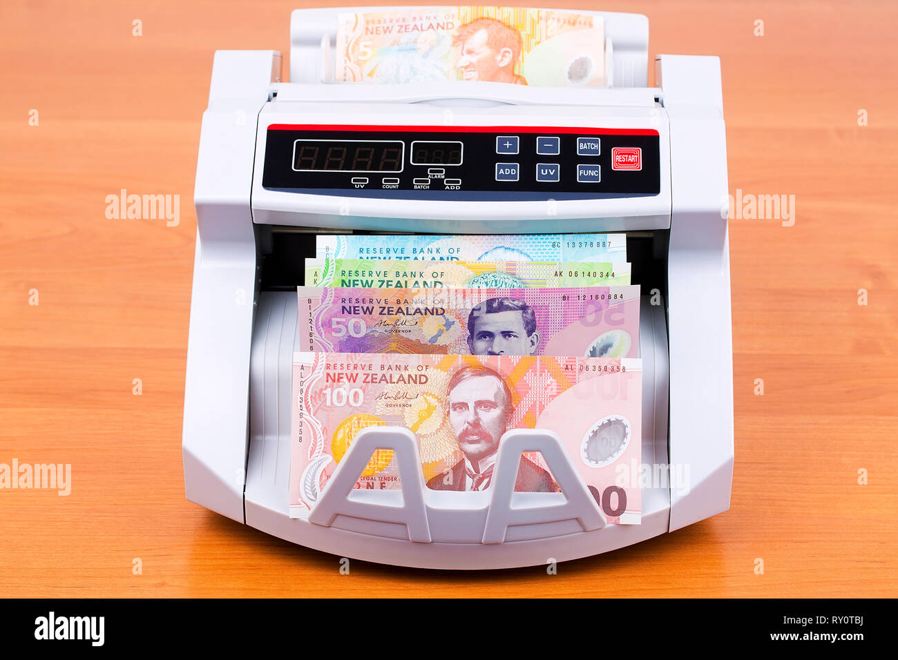 Old New Zealand dollars in a counting machine Stock Photo Alamy