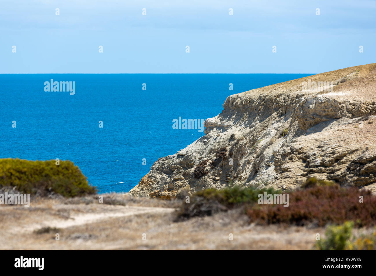 The iconic Port Willunga beach and surrounding cliffs on a clear sunny ...