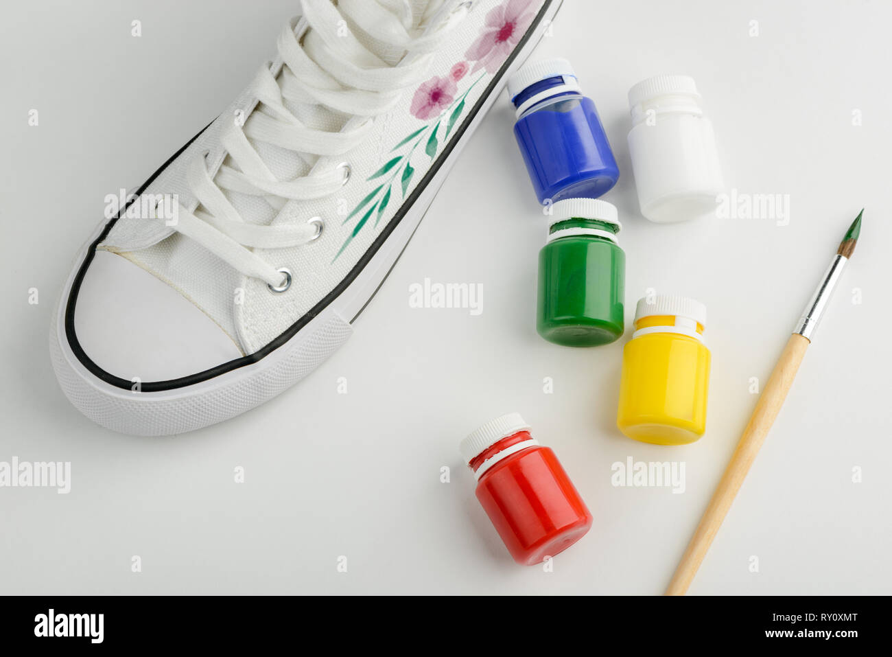 Sneaker with painted flowers Stock Photo - Alamy