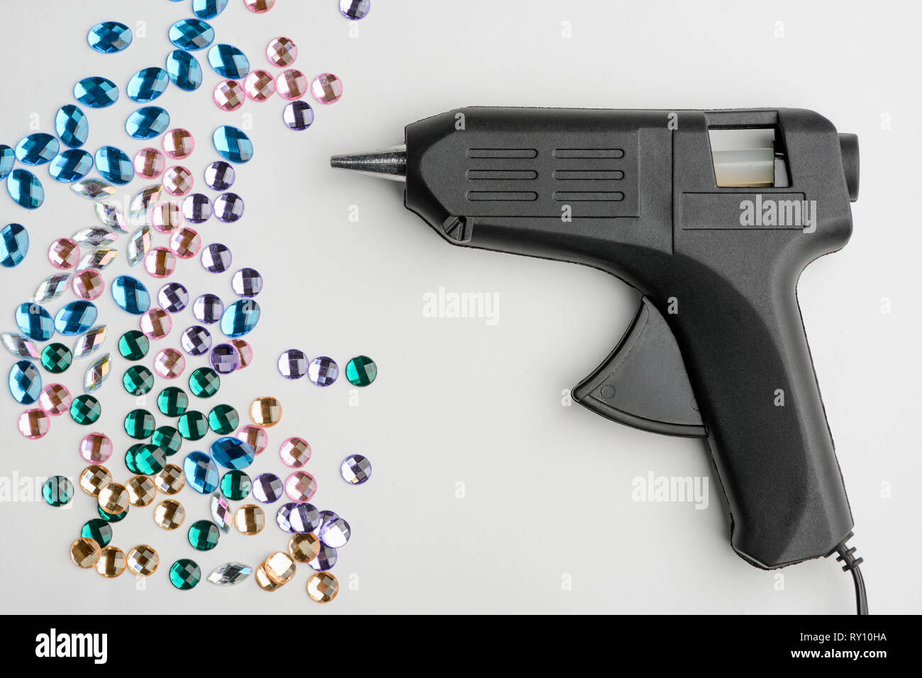 Hot glue gun and rhinestones Stock Photo Alamy