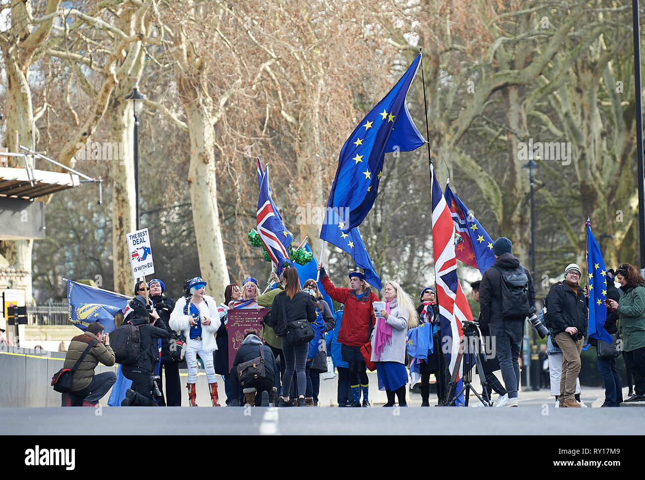 London, UK. 11th Mar, 2019. 11th March 2019.  Pro remain campaigner, enjoy the sun outside Parliament. Credit: Thomas Bowles/Alamy Live News Stock Photo