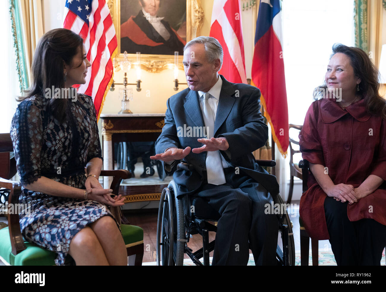 Mary, Crown Princess of Denmark, left, visits with Texas governor Greg Abbott, center, and wife Cecilia during a stop at the Texas Governor's Mansion in Austin. The Crown Princess is on a three-day Texas swing that includes appearances at Austin's SXSW Conference. Stock Photo