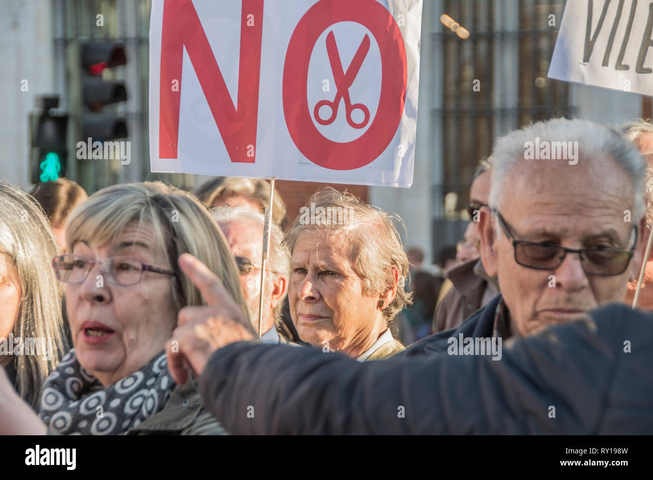 Madrid, Spain. 11th March, 2019. A lady with a placard ¨No more pension cuts¨. People from different regions of Madrid demonstrates againts pension cuts in Spain Credit: Alberto Sibaja Ramírez/Alamy Live News Stock Photo