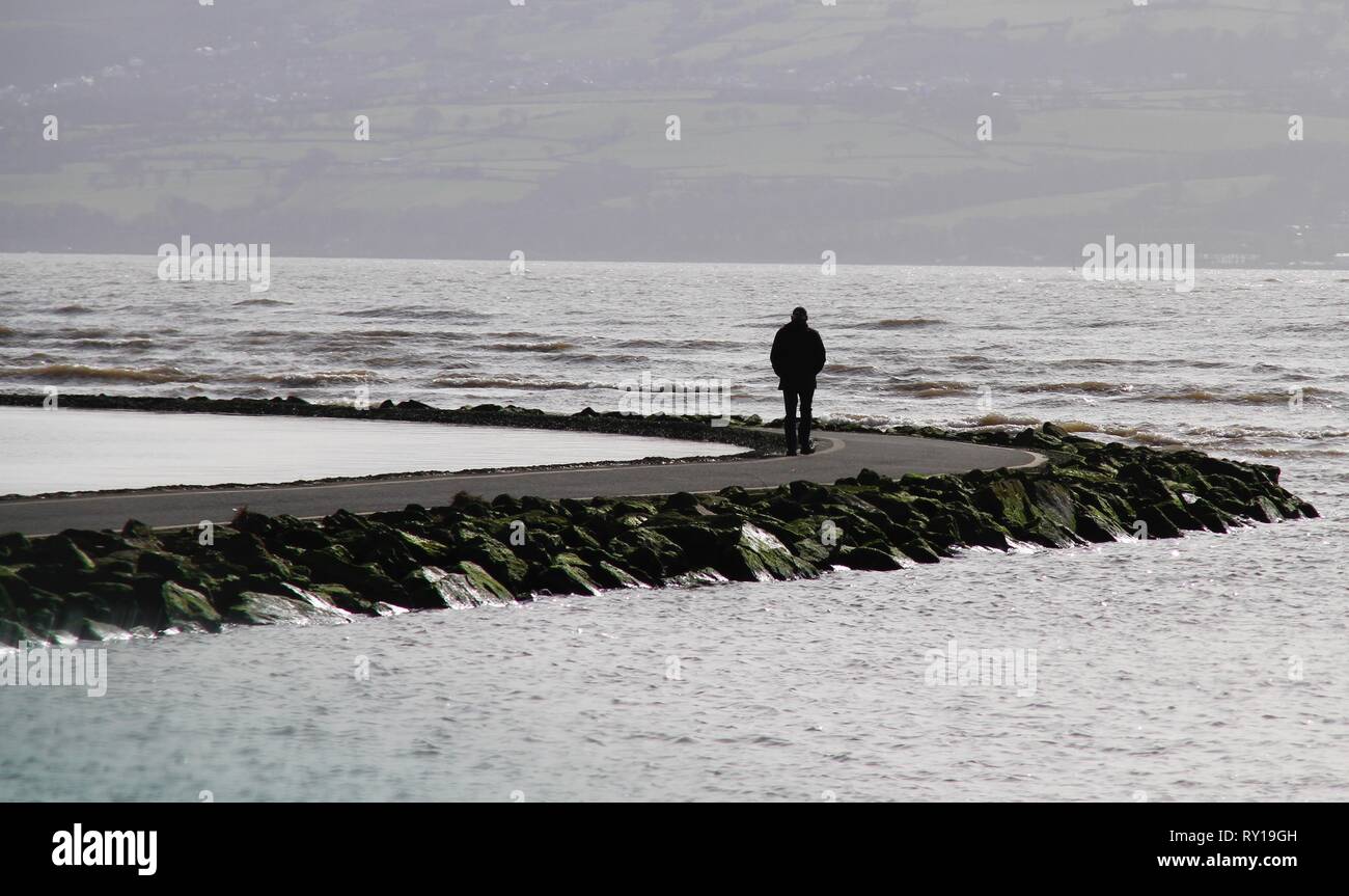 West Kirby, Uk, 11th March 2019, Locals take a stroll in winter sun in west kirby in the Wirral  credit Ian Fairbrother/Alamy Live News Stock Photo