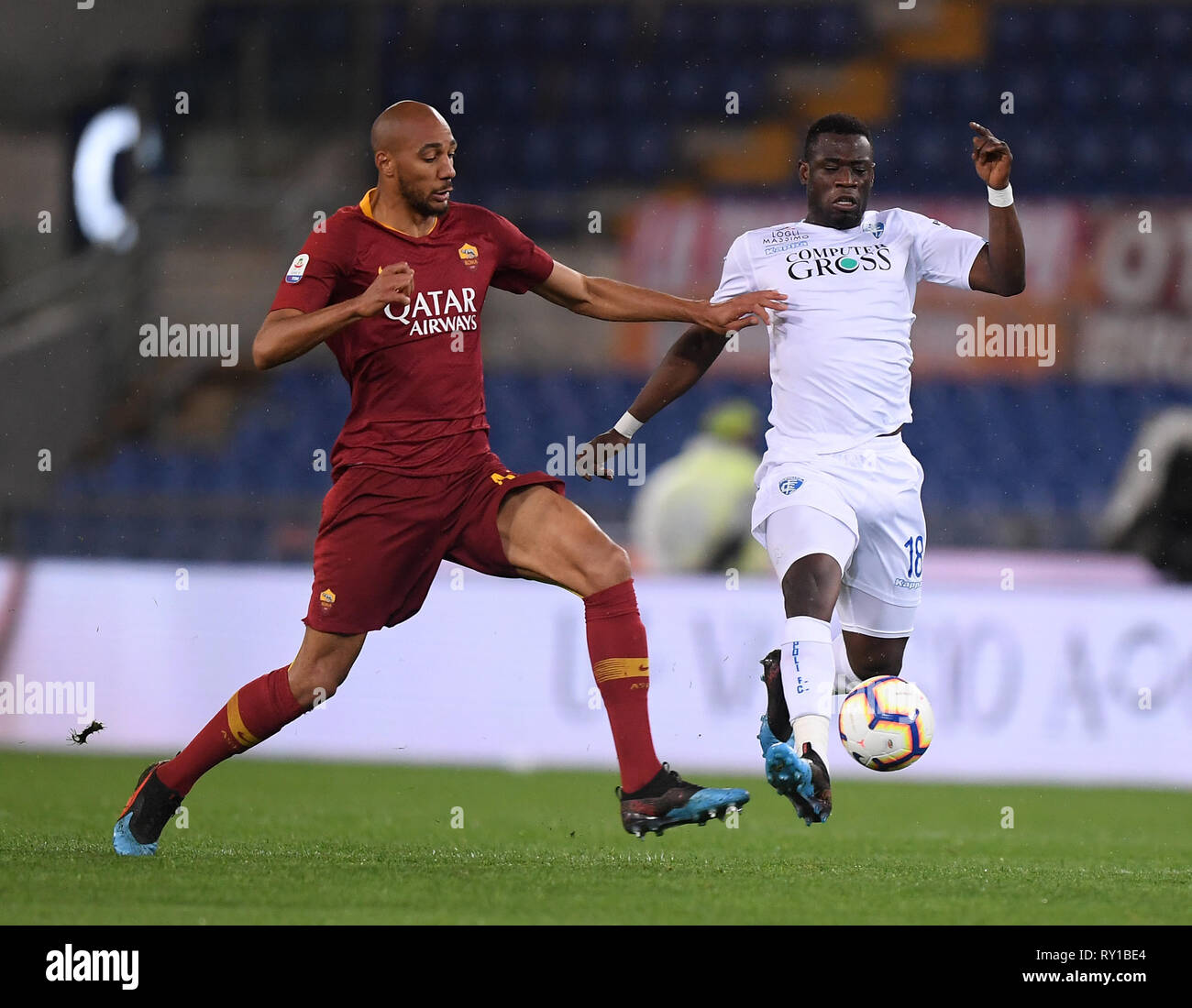 Rome, Italy. 11th Mar, 2019. Roma's Steven N'zonzi (L) vies with Empoli's Afriyie Acquah during a Serie A soccer match in Rome, Italy, March 11, 2019. Roma won 2-1. Credit: Alberto Lingria/Xinhua/Alamy Live News Stock Photo