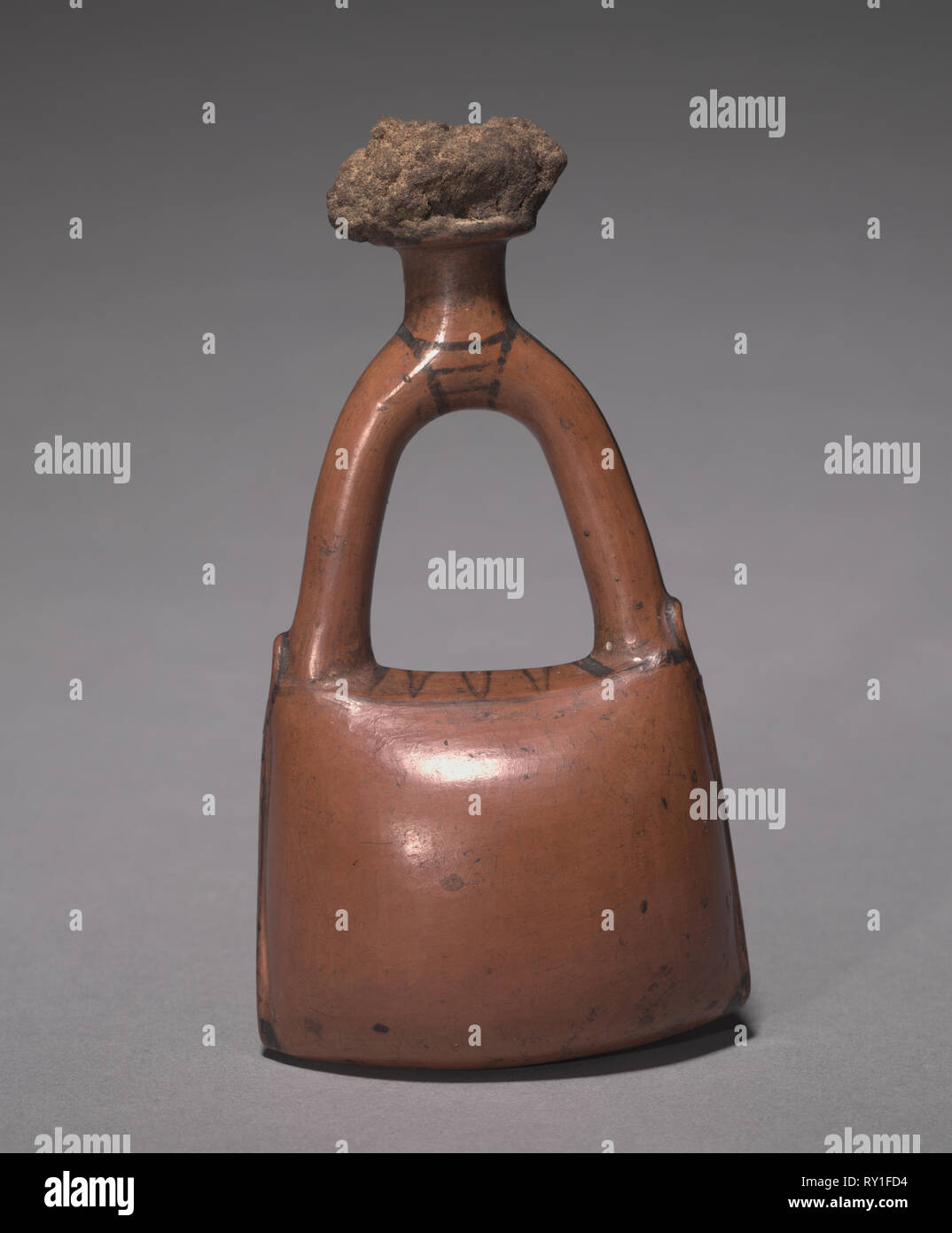 Flask in the Form of a Leather Bag, c. 1415-1381 BC. Egypt, New Kingdom, mid-Dynasty 18, late in the reign of Tuthmosis III to the early reign of Amenhotep III, 1479-1353 BC. Nile silt ware; overall: 13.5 x 7.4 x 5 cm (5 5/16 x 2 15/16 x 1 15/16 in Stock Photo