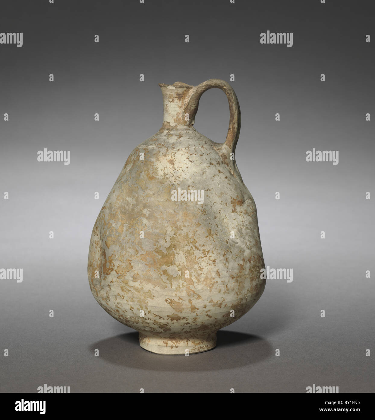 Jug, 1100s-1200s. Iran or Iraq, late Seljuq Period, 11th-13th Century. Earthenware; overall: 15.5 x 11 cm (6 1/8 x 4 5/16 in Stock Photo