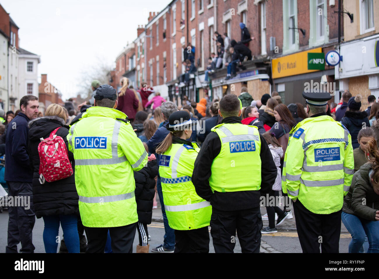 Police look on during the last moments of the Atherstone Ball game. A tradition dating back to the 12th century. Stock Photo