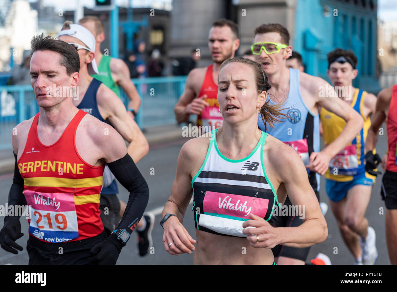 Stephanie Twell and Nicolas Besson 219 running in the Vitality Big Half half marathon crossing Tower Bridge, London, UK. Stock Photo