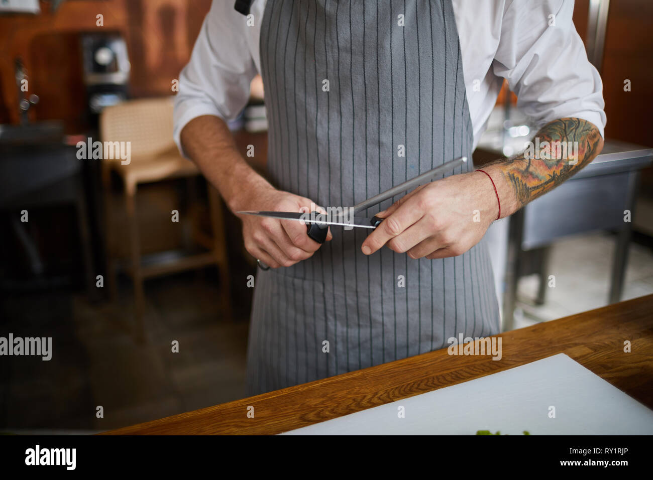 Chef Sharpening Knife Stock Photo Alamy