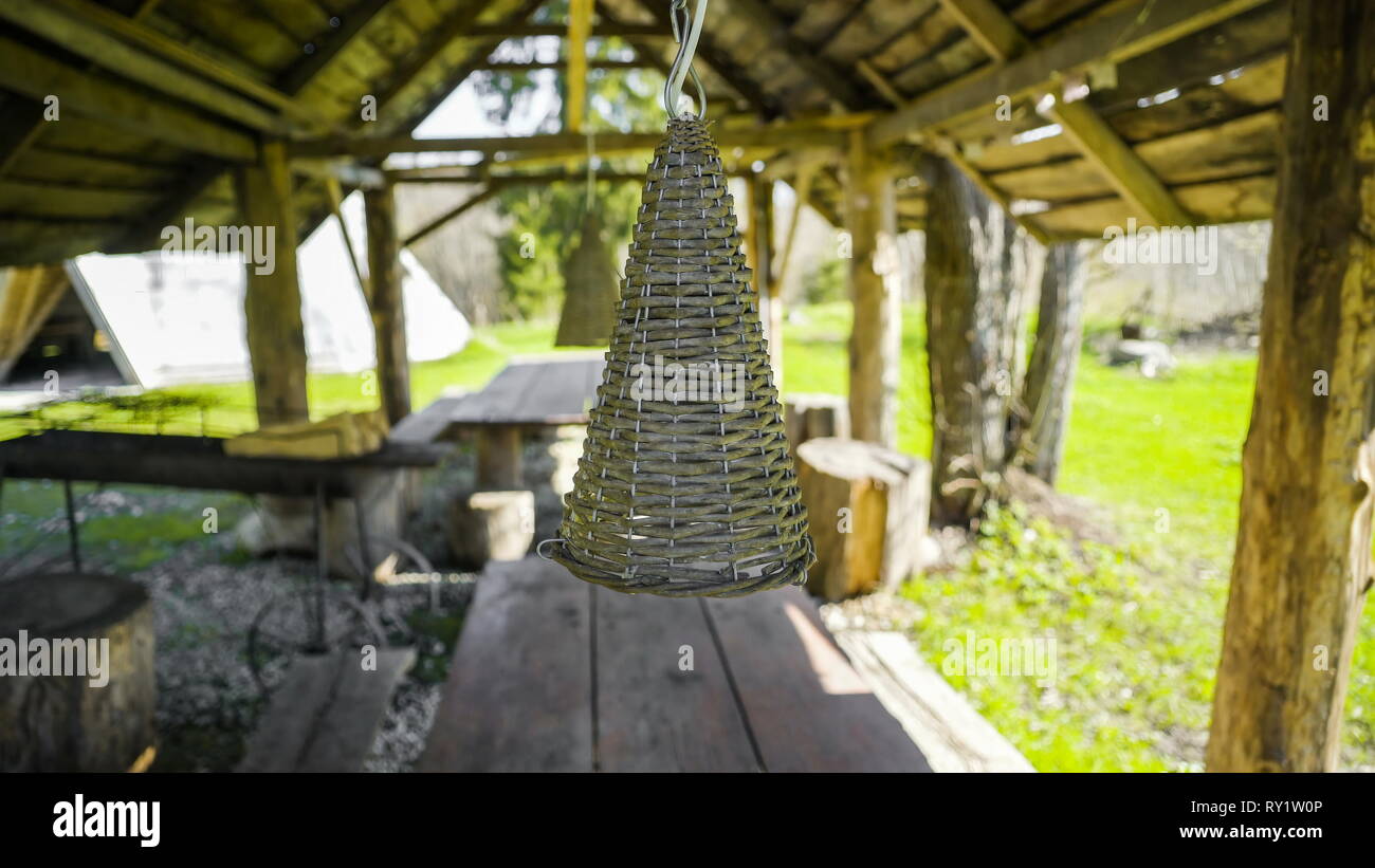 A wooden hanging lamp in the house this is a decoration from the cabin house in the yard Stock Photo
