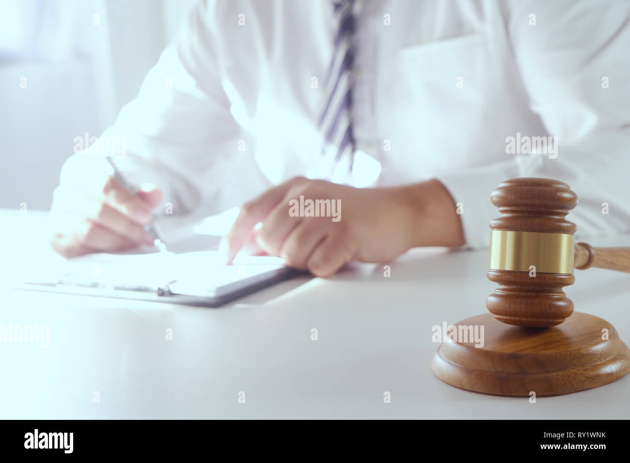 Legal counsel presents a contract with gavel and legal law. justice and lawyer concept Stock Photo