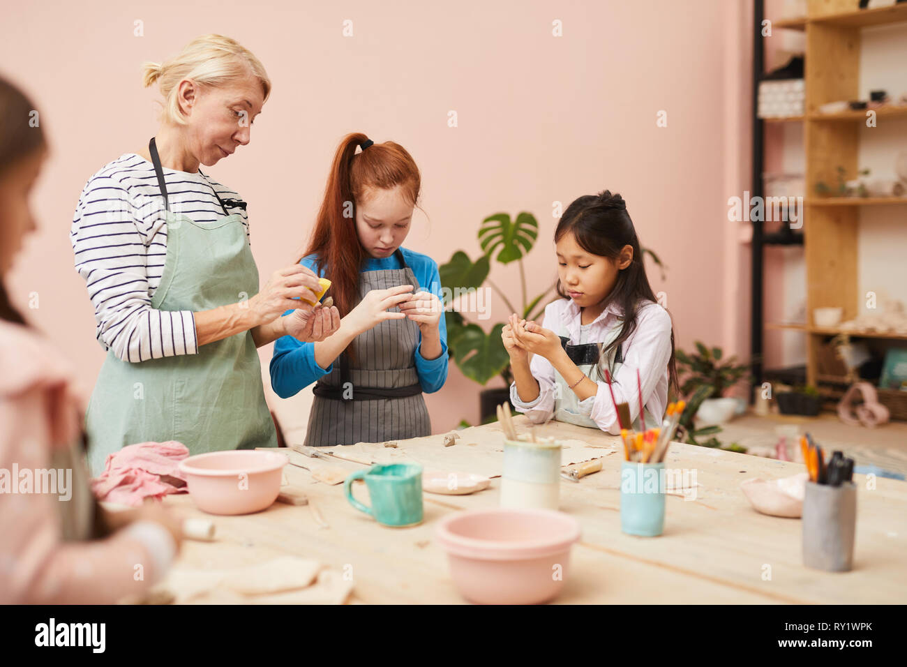 Group of Kids in Pottery Class Stock Photo Alamy