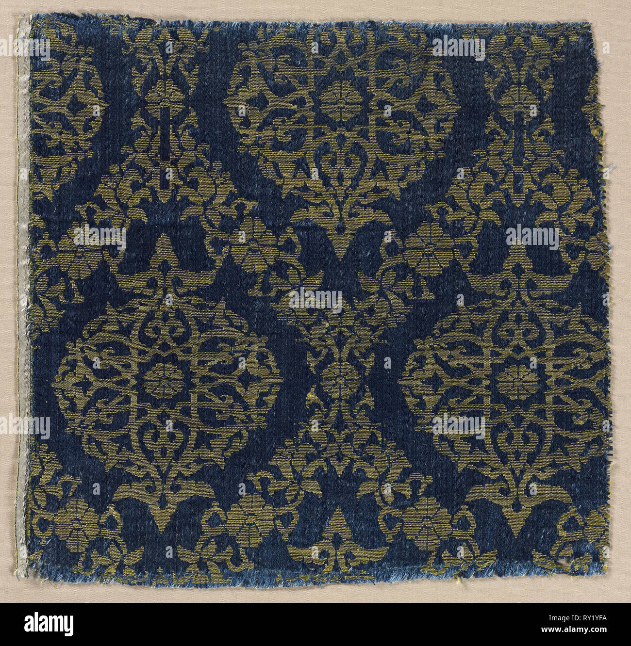 Lampas with foliate medallions in ogival lattice, 1400s. Egypt. Lampas: silk; overall: 21.6 x 22.3 cm (8 1/2 x 8 3/4 in Stock Photo