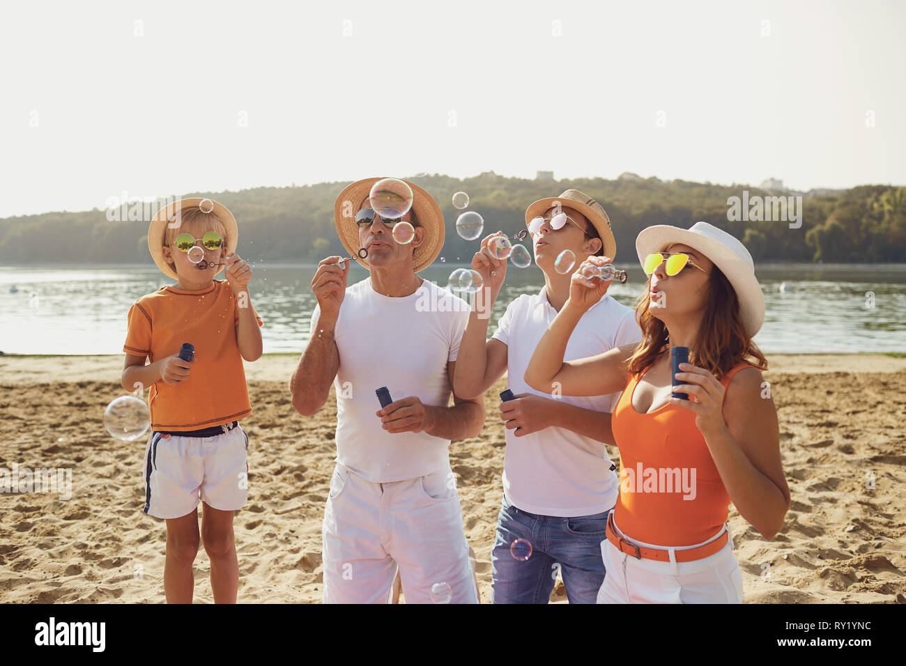 Family on beach playing together hi-res stock photography and images ...