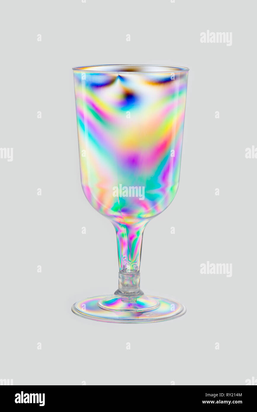 Normally invisible stress patterns made visible with polarised lighting on plastic moulded clear drinks wine glass, photo elasticity Stock Photo