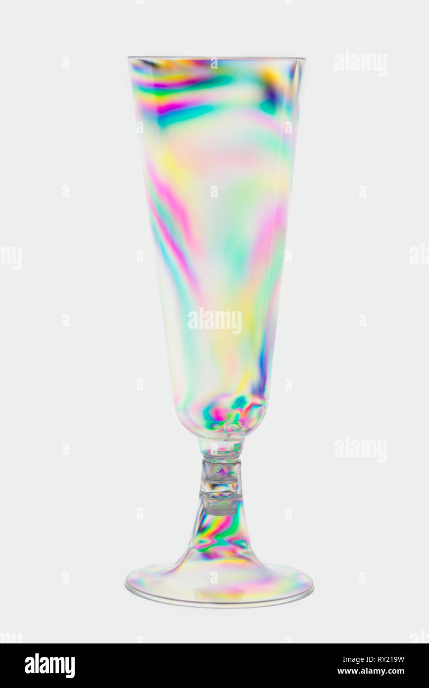 Normally invisible stress patterns made visible with polarised lighting on plastic moulded clear drinks wine glass, photo elasticity Stock Photo
