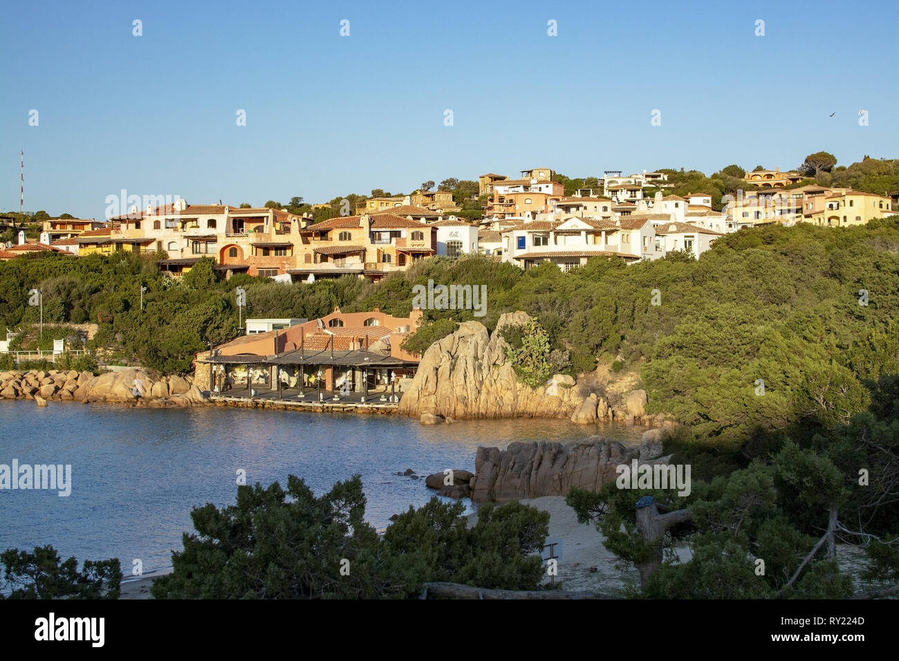 PORTO CERVO, SARDINIA, ITALY - MARCH 2, 2019: Colorful buildings in the port on a sunny afternoon on March 2, 2019 in Porto Cervo, Sardinia, Italy. Stock Photo