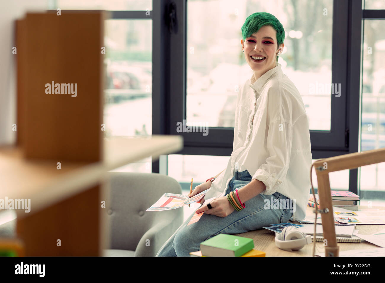 Cheerful positive nice woman being at work Stock Photo