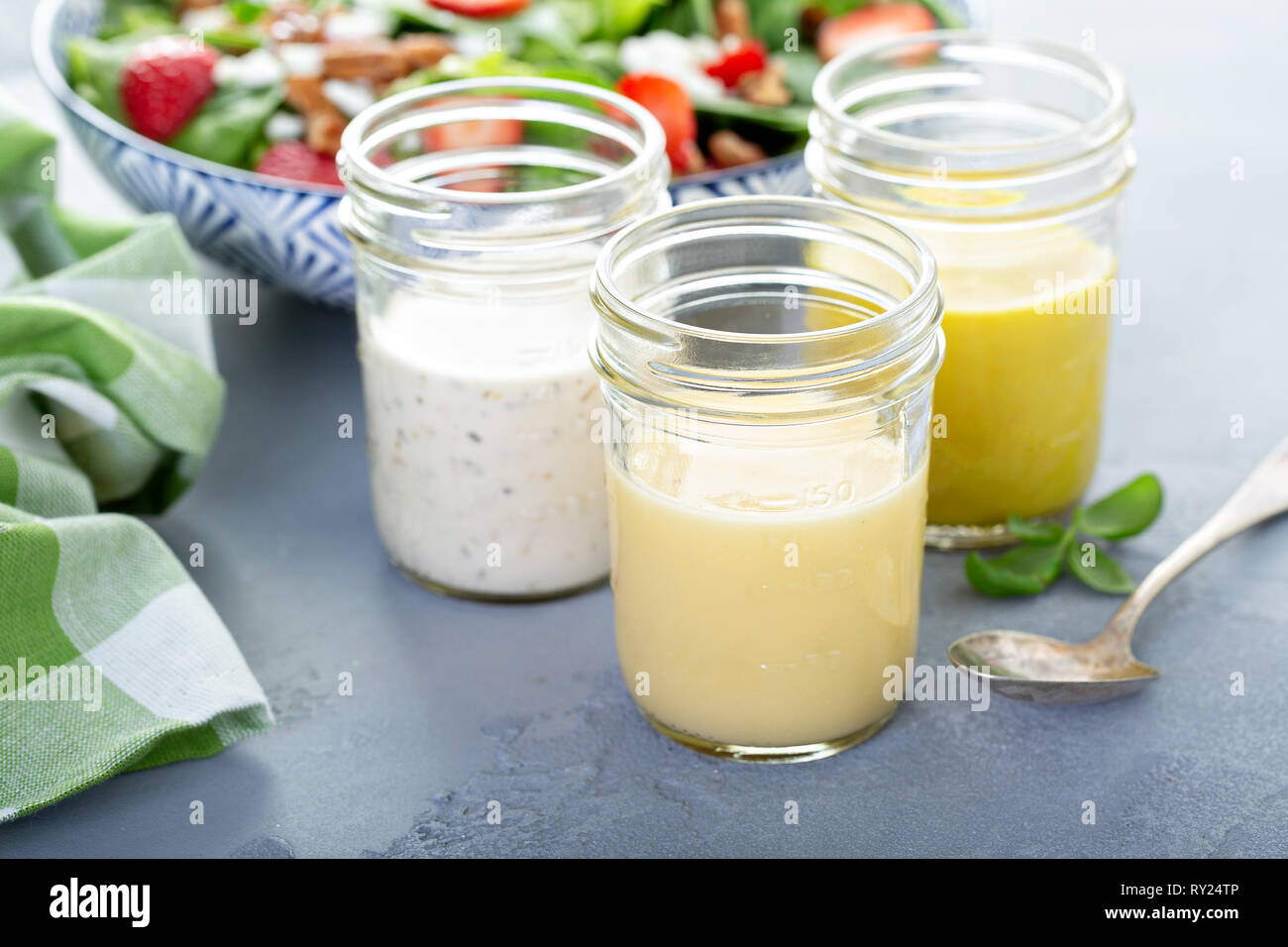 Variety of salad dressings in glass jars Stock Photo Alamy