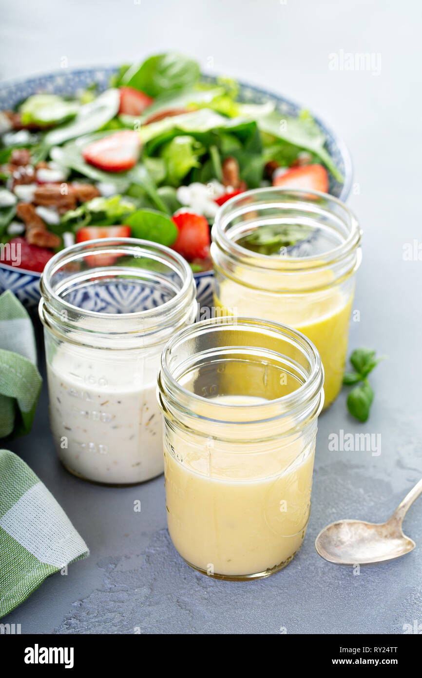 Variety of salad dressings in glass jars Stock Photo Alamy