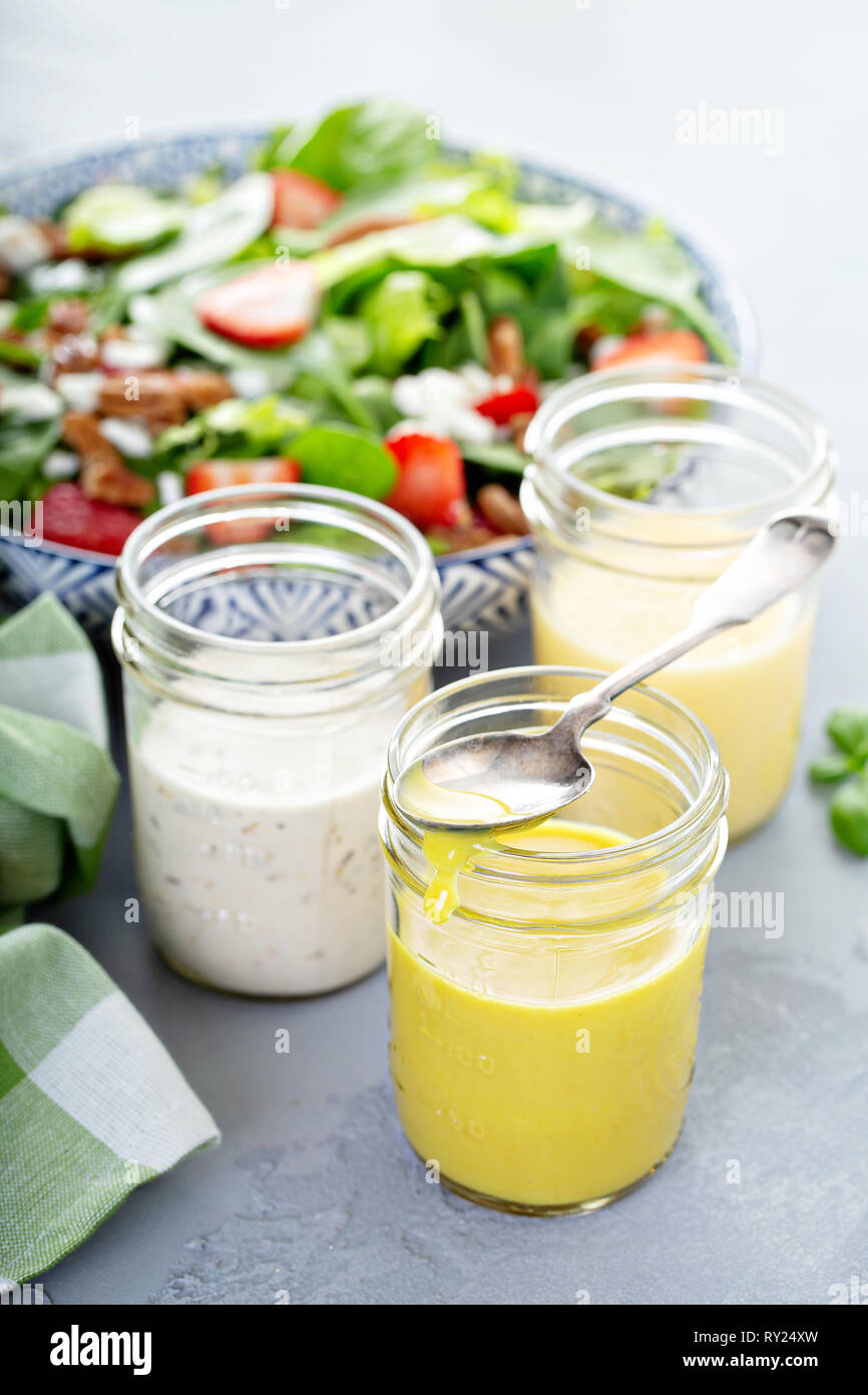 Variety of salad dressings in glass jars Stock Photo Alamy
