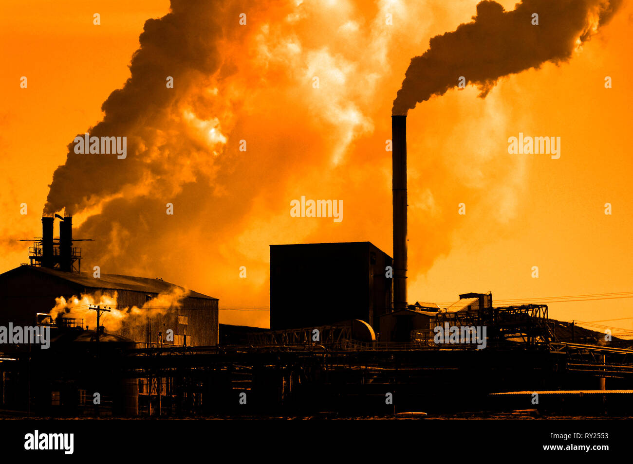 Pollution poor air quality factory smoke stacks environment Stock Photo