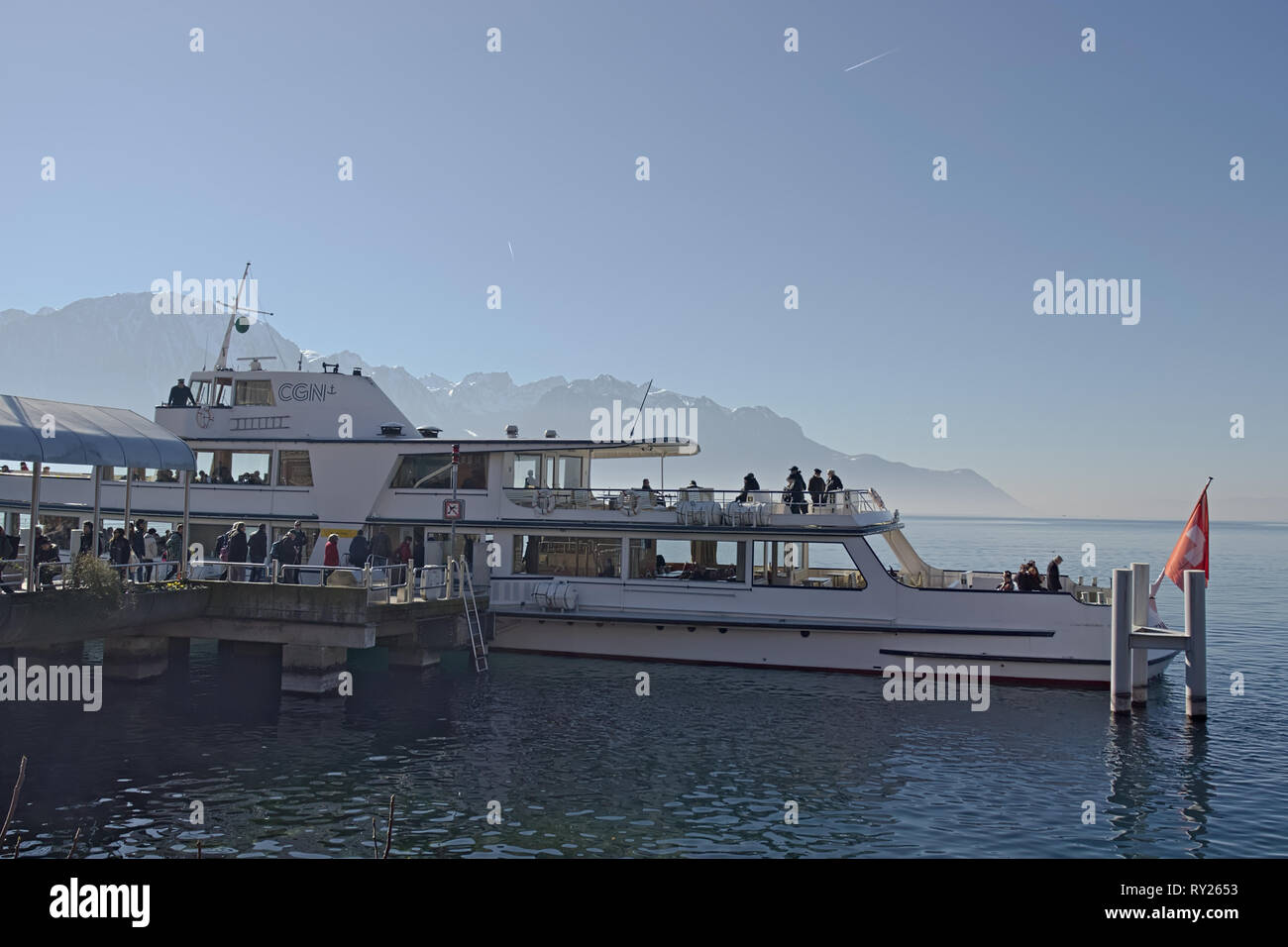 Montreux, Switzerland - 02 17, 2019: Transport ship anchored in montreux embarking passengers. Stock Photo