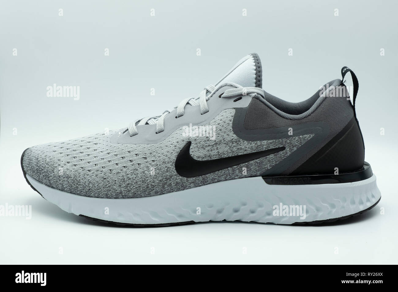 Nike Odyssey React grey running shoe cutout isolated on white background  Stock Photo - Alamy