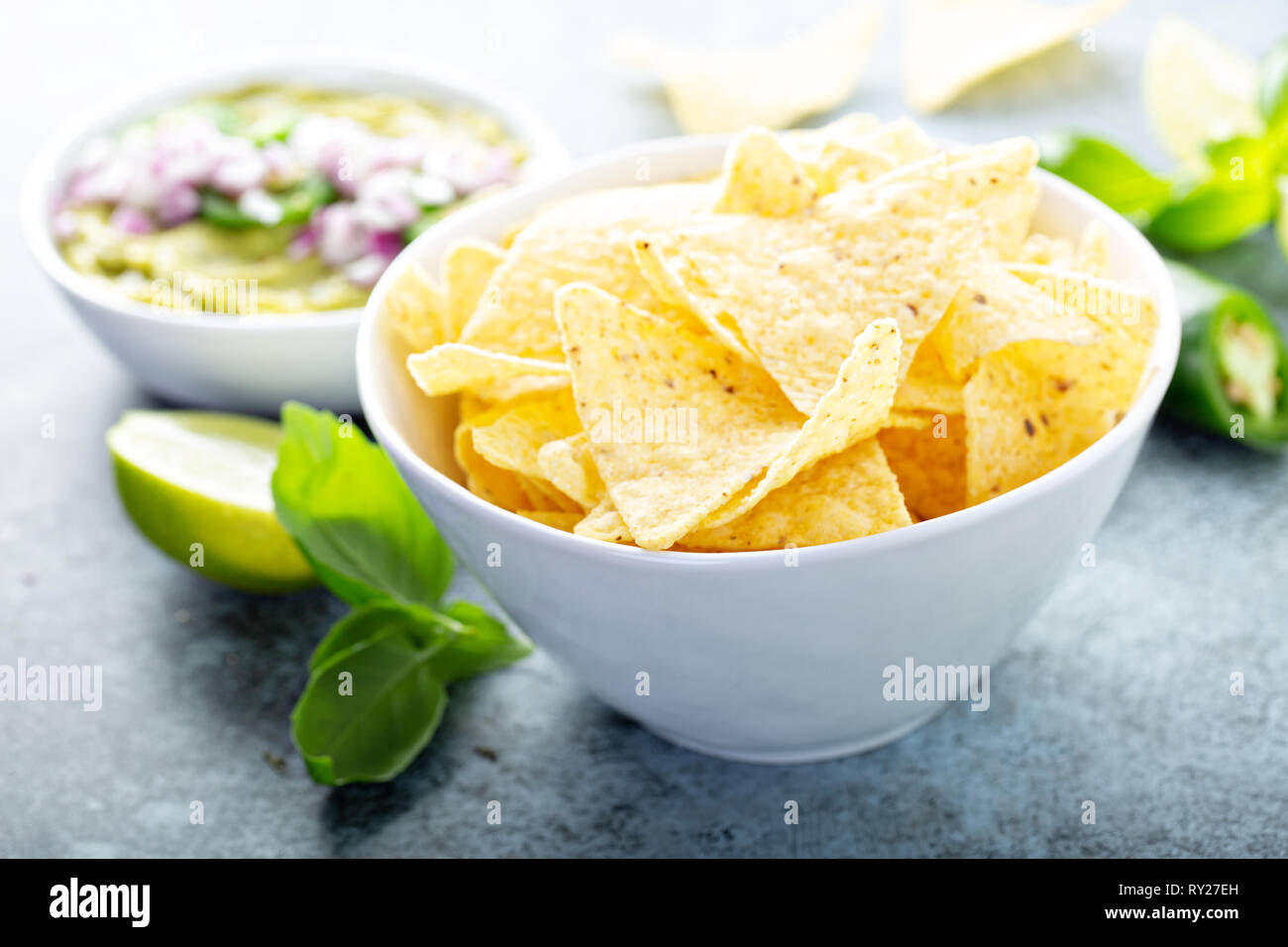 Corn chips with guacamole Stock Photo