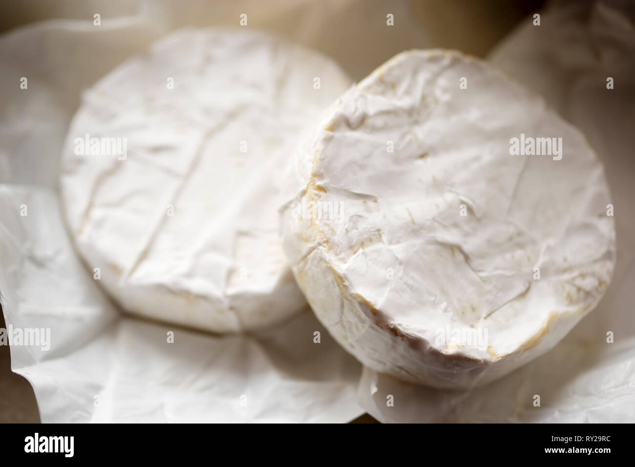 Cut brie cheese Stock Photo Alamy
