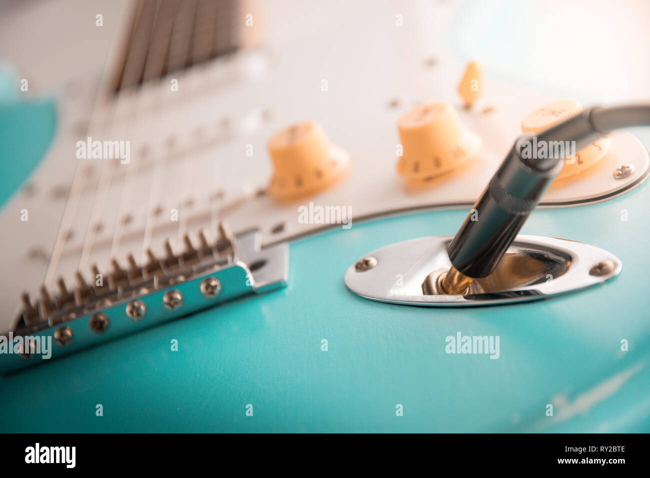 Details and connection of guitar and wire cable jack. Tone and volume