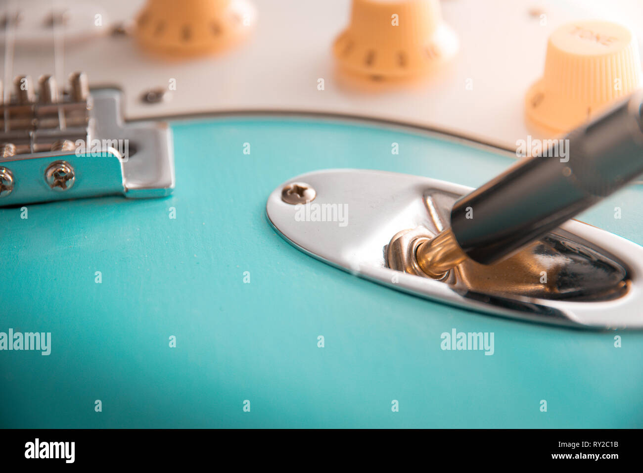 Details and connection of guitar and wire cable jack. Tone and volume