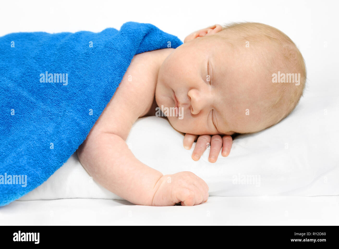 Cute newborn, baby boy sleeping on a white blanket Stock Photo - Alamy