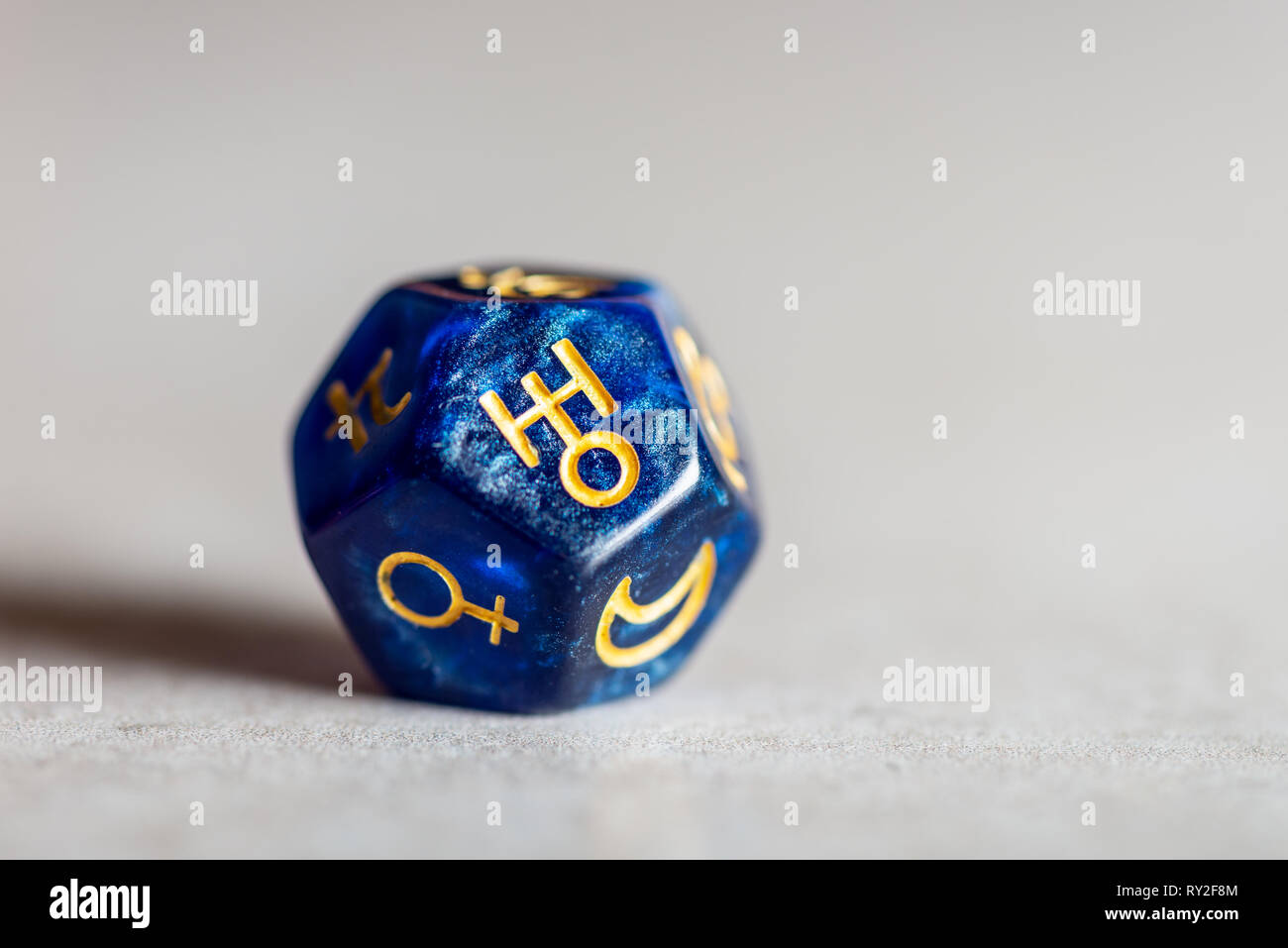 Astrology Dice with symbol of the planet Uranus Stock Photo