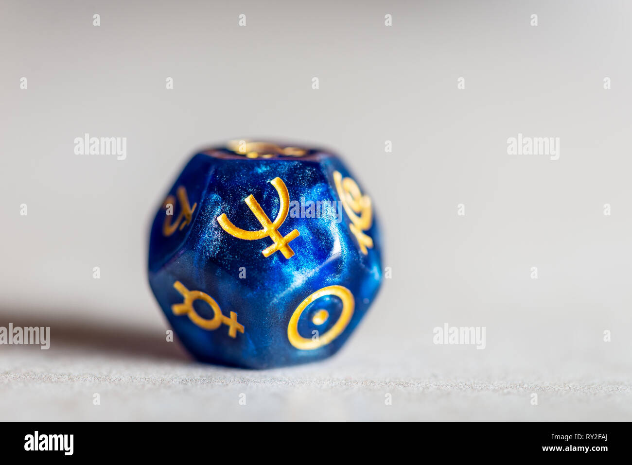 Astrology Dice with symbol of the planet Neptune Stock Photo