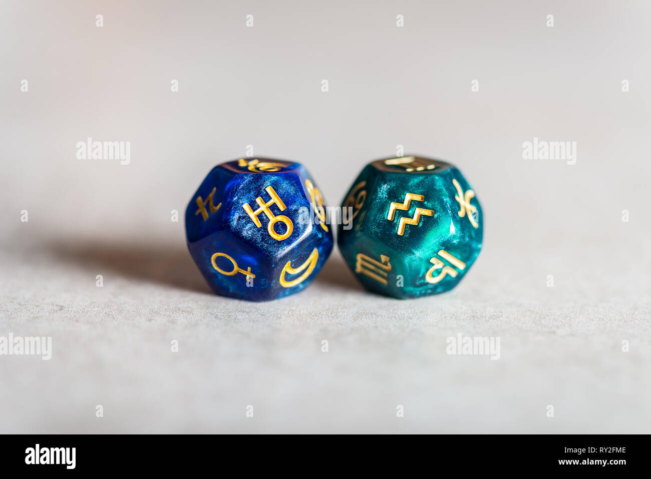 Astrology Dice with zodiac symbol of Aquarius and its ruling planet Uranus Stock Photo