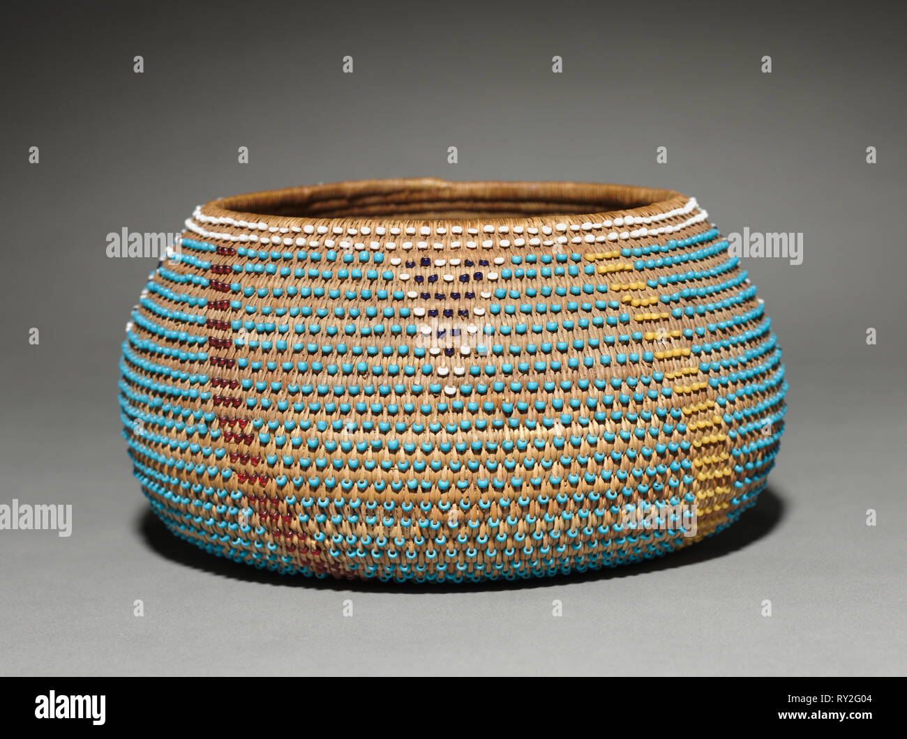 Gift Bowl, c. 1890- 1905. California, Wappo, late 19th- early 20th century. Sedge with beads; coiled ( 3 rods); overall: 8 x 15 cm (3 1/8 x 5 7/8 in Stock Photo