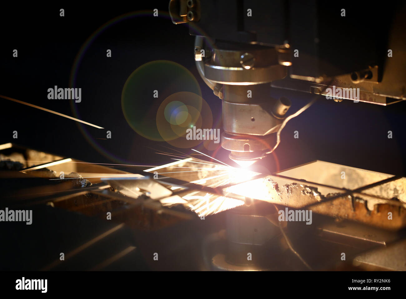 Sparks fly out machine head for metal processing Stock Photo